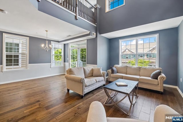73 Autumn Way Unit 24, Montvale, NJ 07645 - living area featuring a chandelier, hardwood / wood-style floors, and ornamental molding