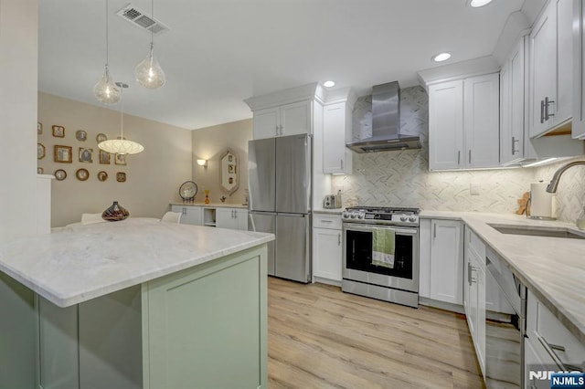 669 Juniper Way, Mahwah, NJ 07430 - kitchen featuring wall chimney exhaust hood, appliances with stainless steel finishes, white cabinets, tasteful backsplash, and recessed lighting