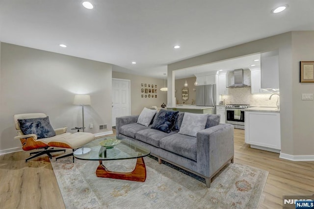 669 Juniper Way, Mahwah, NJ 07430 - living area with light wood finished floors and recessed lighting
