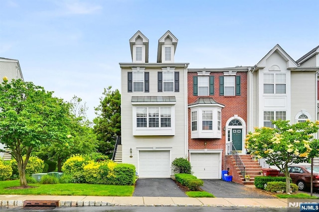 231 Swathmore Dr, Nutley, NJ 07110 - townhome / multi-family property with asphalt driveway and an attached garage
