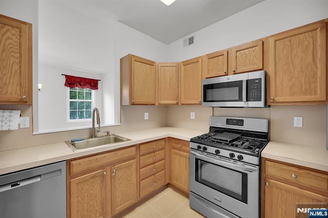 231 Swathmore Dr, Nutley, NJ 07110 - kitchen with appliances with stainless steel finishes, light countertops, and light tile patterned floors