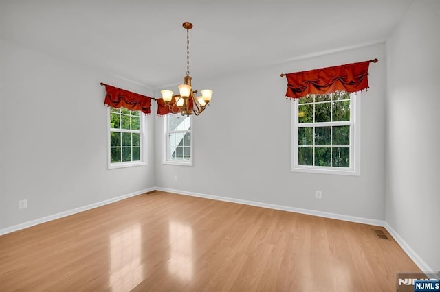 231 Swathmore Dr, Nutley, NJ 07110 - spare room featuring a chandelier and light wood-style floors