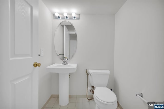 231 Swathmore Dr, Nutley, NJ 07110 - bathroom with toilet and tile patterned flooring