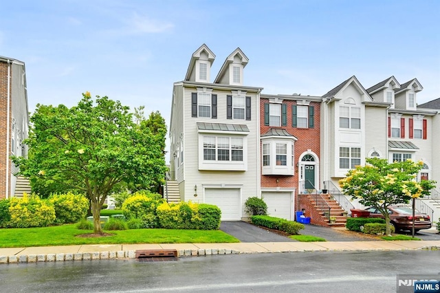 231 Swathmore Dr, Nutley, NJ 07110 - townhome / multi-family property featuring asphalt driveway and a garage