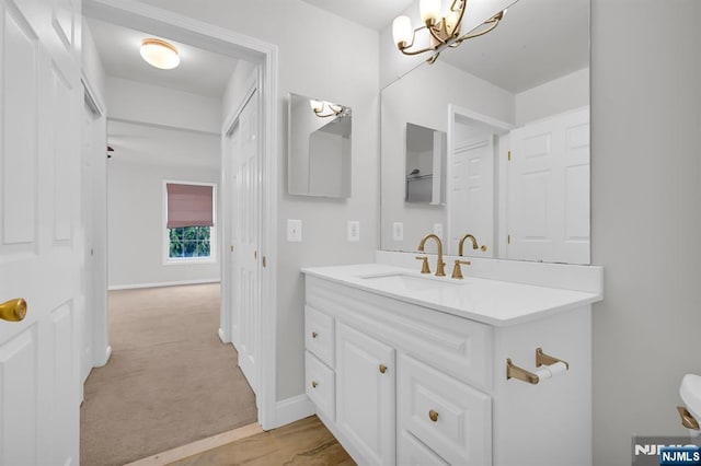 231 Swathmore Dr, Nutley, NJ 07110 - bathroom with a chandelier and vanity