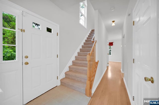 231 Swathmore Dr, Nutley, NJ 07110 - entrance foyer featuring plenty of natural light, stairs, and light wood-type flooring