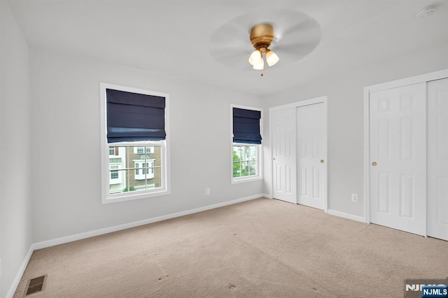 231 Swathmore Dr, Nutley, NJ 07110 - unfurnished bedroom featuring carpet flooring, multiple closets, and a ceiling fan