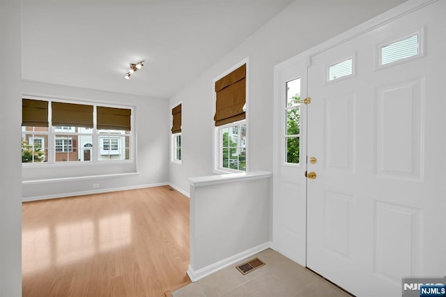 231 Swathmore Dr, Nutley, NJ 07110 - foyer entrance with baseboards and light wood-style floors