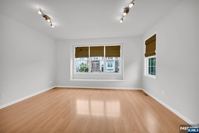 231 Swathmore Dr, Nutley, NJ 07110 - unfurnished room with track lighting, healthy amount of natural light, and light wood-type flooring