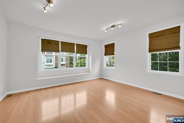 231 Swathmore Dr, Nutley, NJ 07110 - spare room with wood finished floors and track lighting