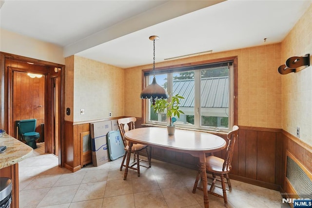 405 Abbott Ave, Ridgefield, NJ 07657 - dining space with wainscoting and light tile patterned flooring