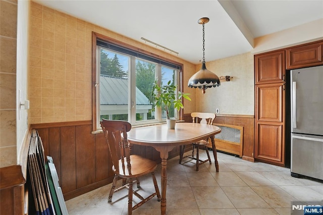 405 Abbott Ave, Ridgefield, NJ 07657 - dining area with light tile patterned floors and a wainscoted wall