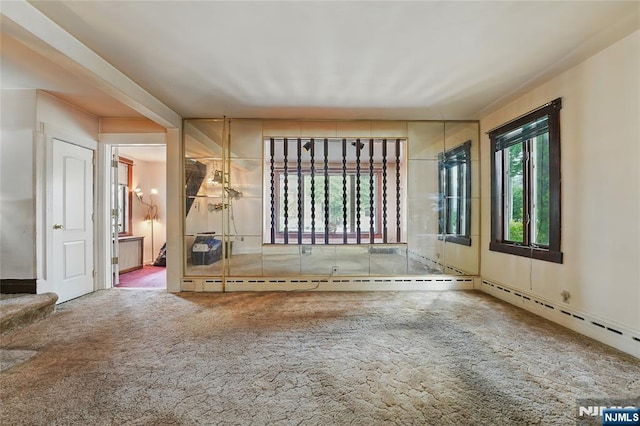 405 Abbott Ave, Ridgefield, NJ 07657 - unfurnished living room featuring carpet and baseboard heating