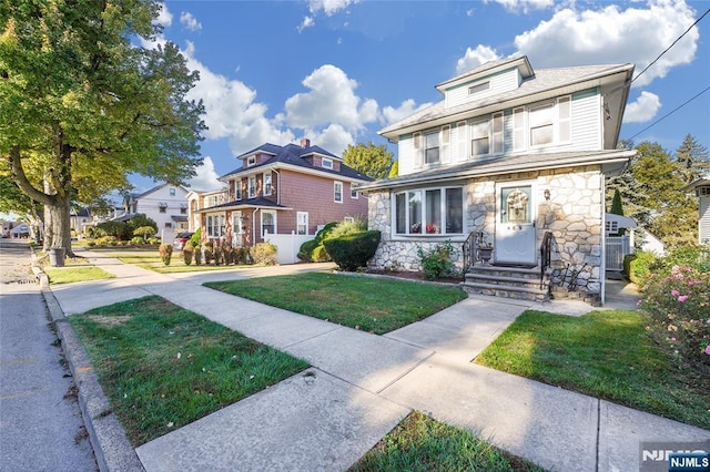 405 Abbott Ave, Ridgefield, NJ 07657 - traditional style home with a front yard and stone siding