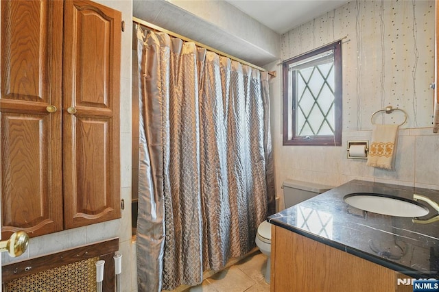 405 Abbott Ave, Ridgefield, NJ 07657 - bathroom featuring vanity, tile patterned floors, and tile walls