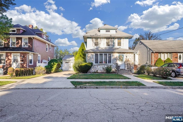 405 Abbott Ave, Ridgefield, NJ 07657 - american foursquare style home featuring an outdoor structure, concrete driveway, stone siding, and a garage
