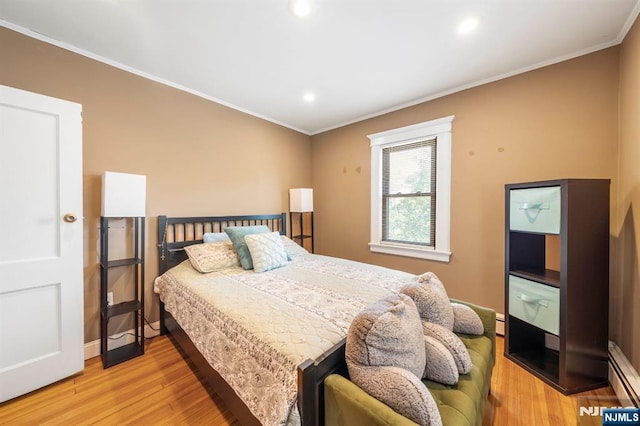 178-180 17th Ave, Paterson, NJ 07504 - bedroom featuring light wood-style flooring, ornamental molding, recessed lighting, and a baseboard heating unit