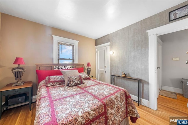 178-180 17th Ave, Paterson, NJ 07504 - bedroom featuring wood finished floors and wallpapered walls