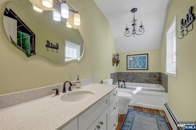 178 Arthur St, Hillsdale, NJ 07642 - full bath featuring wood finished floors, vanity, a baseboard heating unit, a bath, and lofted ceiling