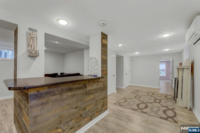 178 Arthur St, Hillsdale, NJ 07642 - indoor dry bar with a wall unit AC, light wood-style floors, and recessed lighting