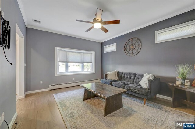 178 Arthur St, Hillsdale, NJ 07642 - living area with a baseboard radiator, wood finished floors, ceiling fan, and ornamental molding