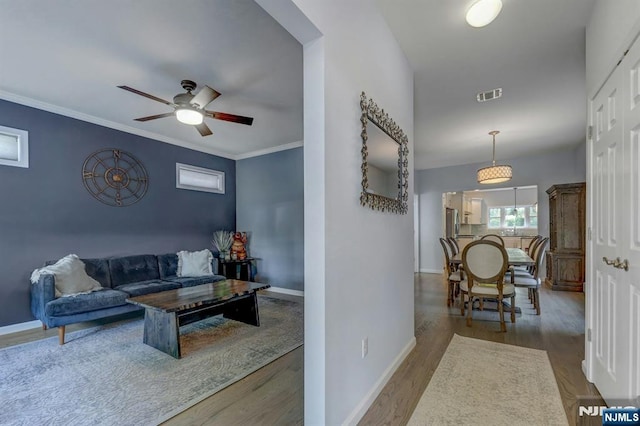178 Arthur St, Hillsdale, NJ 07642 - living room with ceiling fan, wood finished floors, and ornamental molding