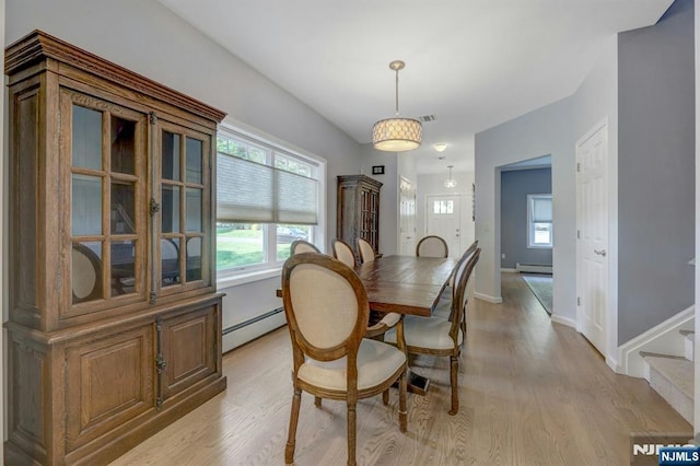 178 Arthur St, Hillsdale, NJ 07642 - dining space with baseboard heating, light wood-style floors, and a baseboard heating unit