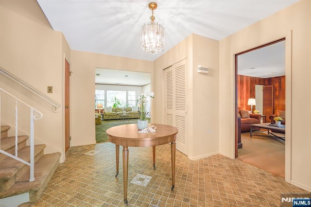 24 Eton Ct, Wayne, NJ 07470 - foyer featuring a chandelier, stairway, and wood walls