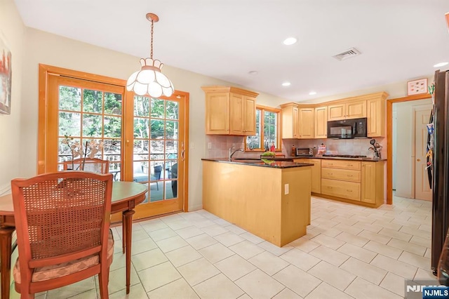 24 Eton Ct, Wayne, NJ 07470 - kitchen featuring black microwave, light brown cabinetry, a peninsula, dark countertops, and stainless steel gas stovetop