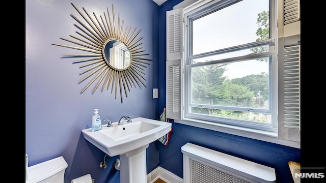 118 High St, Nutley, NJ 07110 - bathroom featuring radiator heating unit and toilet