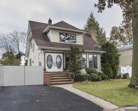 237 Elm Ave, Teaneck, NJ 07666 - view of front of house with a chimney