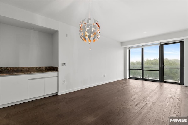320 Adolphus Ave Unit 604, Cliffside Park, NJ 07010 - unfurnished dining area with a chandelier and dark wood-style floors