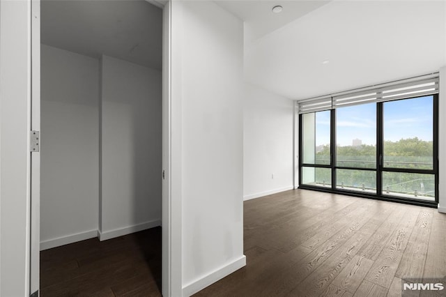 320 Adolphus Ave Unit 604, Cliffside Park, NJ 07010 - empty room featuring a wall of windows and hardwood / wood-style floors