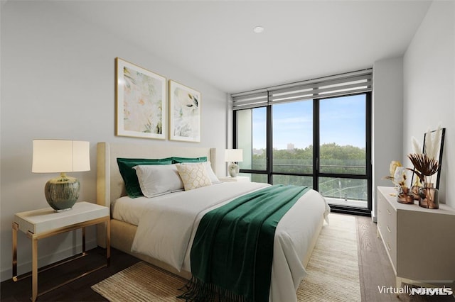 320 Adolphus Ave Unit 604, Cliffside Park, NJ 07010 - bedroom featuring access to exterior, wood finished floors, and a wall of windows