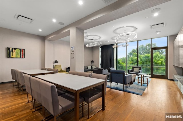 320 Adolphus Ave Unit 604, Cliffside Park, NJ 07010 - dining area with wood finished floors, a wall of windows, and recessed lighting