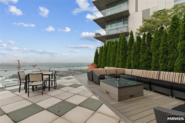 320 Adolphus Ave Unit 604, Cliffside Park, NJ 07010 - view of patio with an outdoor living space with a fire pit, outdoor dining area, and a water view