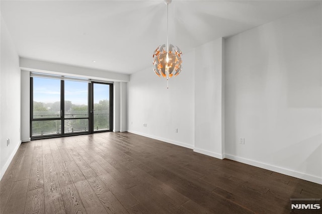 320 Adolphus Ave Unit 604, Cliffside Park, NJ 07010 - empty room featuring dark wood-style flooring and a chandelier