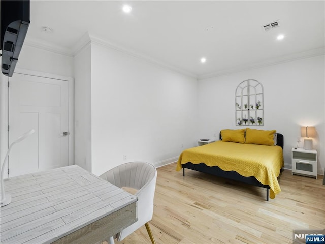 1050 Bond St, Elizabeth, NJ 07201 - bedroom with crown molding, light wood-style flooring, and recessed lighting