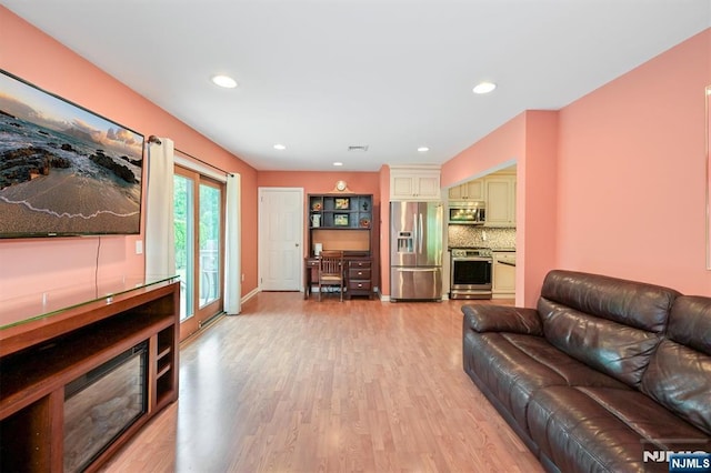 16 Murray Rd, Montvale, NJ 07645 - living area with light wood-style floors and recessed lighting