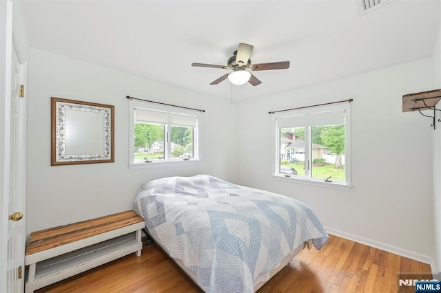 16 Murray Rd, Montvale, NJ 07645 - bedroom with multiple windows, wood finished floors, and ceiling fan