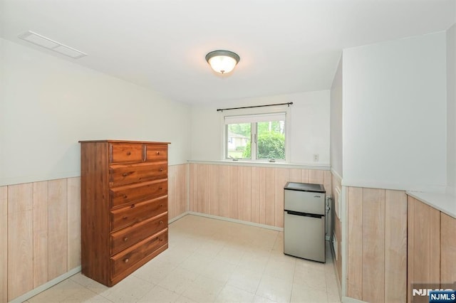 16 Murray Rd, Montvale, NJ 07645 - spare room with wainscoting, wooden walls, and light floors