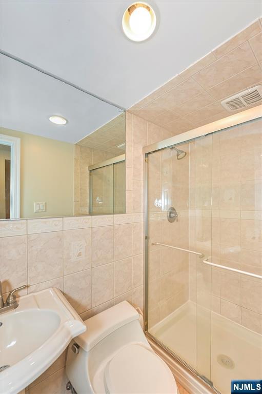 16 Murray Rd, Montvale, NJ 07645 - full bath with tile walls and a shower stall