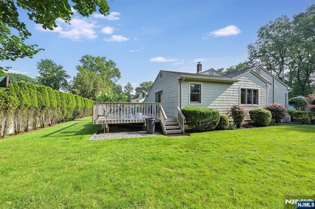 16 Murray Rd, Montvale, NJ 07645 - back of property with a wooden deck and a chimney