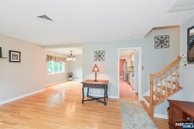 16 Murray Rd, Montvale, NJ 07645 - corridor featuring a chandelier, light wood-style floors, and stairway