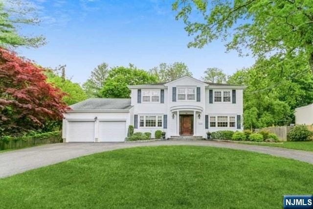 74 O Shaughnessy Ln, Closter, NJ 07624 - view of front facade featuring curved driveway and a garage