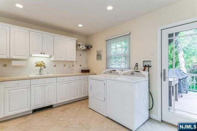 74 O Shaughnessy Ln, Closter, NJ 07624 - washroom with washer and dryer, plenty of natural light, cabinet space, recessed lighting, and light tile patterned floors