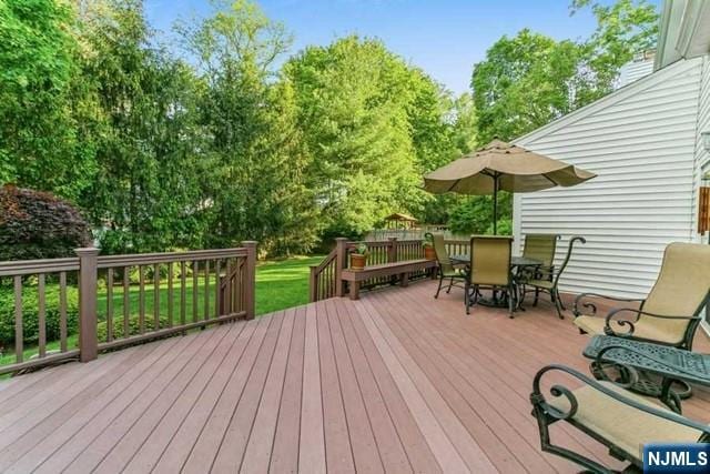 74 O Shaughnessy Ln, Closter, NJ 07624 - wooden terrace with outdoor dining space and view of wooded area
