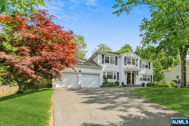 74 O Shaughnessy Ln, Closter, NJ 07624 - view of front of property with asphalt driveway and an attached garage