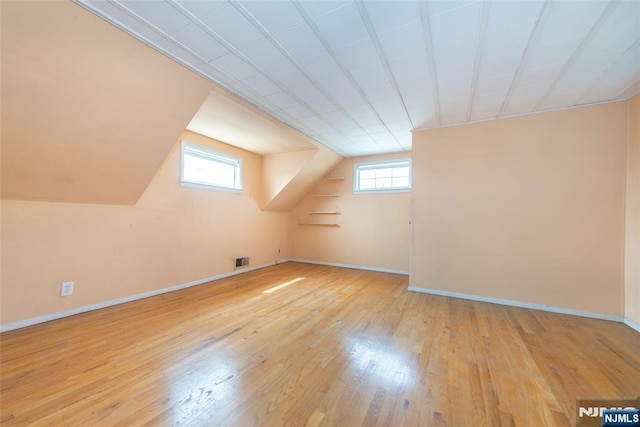 744 9th St, Carlstadt, NJ 07072 - additional living space featuring hardwood / wood-style floors and vaulted ceiling