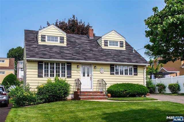 744 9th St, Carlstadt, NJ 07072 - cape cod home featuring entry steps, a chimney, and roof with shingles